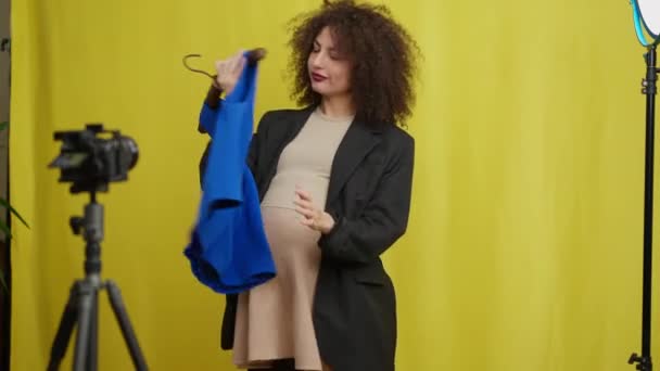 Beautiful Pregnant Woman Trying New Clothes Filming Vlog Indoors Portrait — 비디오