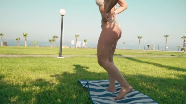 Confident Flexible Caucasian Young Woman Standing Bending Back Exercise Mat — Stok video