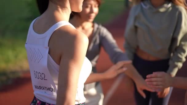 Group Unrecognizable Young Sportswomen Stacking Hands Gesturing Slow Motion Marathon — Stock Video