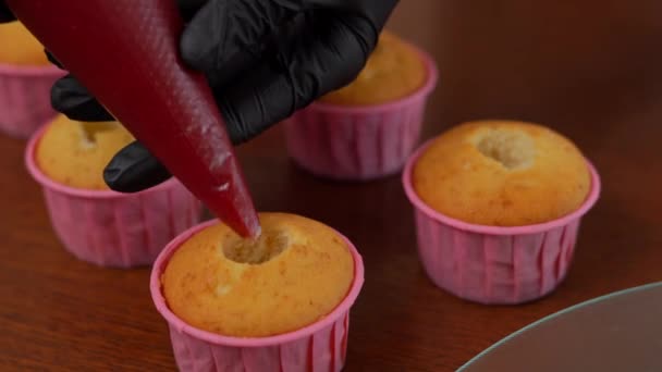 Close Filling Holes Baked Muffins Red Jam Indoors Female Hands — Stock Video