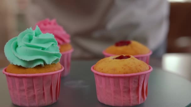Mixed Pink Green Royal Icing Pouring Pastry Bag Baked Muffin — Stock Video
