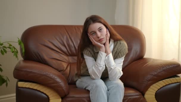 Zoom Portrait Charming Teenage Girl Looking Away Dreaming Sitting Indoors — Stock Video