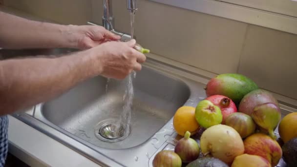 Male Caucasian Hands Washing Fruits Halving Passion Fruit Sink Kitchen — Stock Video