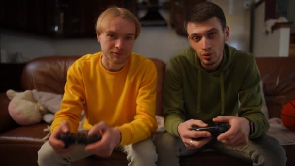 Nervous Man Leaving Room Losing Video Game Playing Friend Indoors — Stock Video