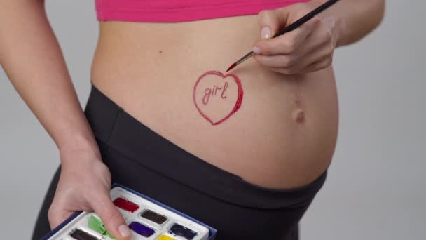Close Pregnant Woman Holds Watercolor Paints Her Hand Paints Heart — Stock Video