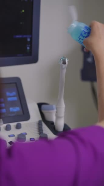 Vertical Video Shoulder Shot Gynecologist Applies Clear Gel Blue Plastic — Stock Video