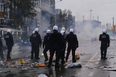 Fas taraftarları, Belçika 'nın Brüksel kentinde 27 Kasım 2022 tarihinde oynanan Katar 2022 Dünya Kupası futbol karşılaşması sonrasında çevik kuvvet ekibiyle çatıştı..