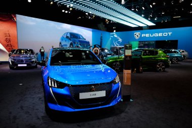 Peugeot car on display during the opening of the Brussels Motor Show at the Expo in Brussels, Belgium on Jan. 13, 2023. clipart