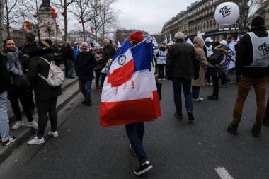 Protesters take part in a demonstration against the pension overhauls in Paris, France on January 19, 2023. 