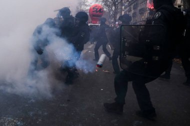 Protesters take part in a demonstration against the pension overhauls in Paris, France on January 19, 2023. 