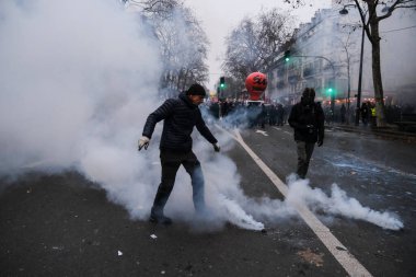 Protesters take part in a demonstration against the pension overhauls in Paris, France on January 19, 2023. 