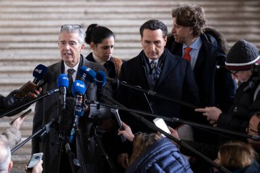 Lawyers of former EU Parliament Vice-President Eva Kaili, Michalis Dimitrakopoulos and Andre Risopoulos speak with the media at the courthouse in Brussels, Belgium on  January 19, 2023