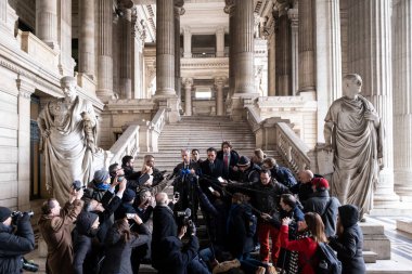 Lawyers of former EU Parliament Vice-President Eva Kaili, Michalis Dimitrakopoulos and Andre Risopoulos speak with the media at the courthouse in Brussels, Belgium on  January 19, 2023