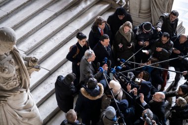 Lawyers of former EU Parliament Vice-President Eva Kaili, Michalis Dimitrakopoulos and Andre Risopoulos speak with the media at the courthouse in Brussels, Belgium on  January 19, 2023