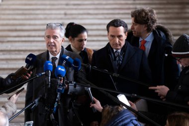 Lawyers of former EU Parliament Vice-President Eva Kaili, Michalis Dimitrakopoulos and Andre Risopoulos speak with the media at the courthouse in Brussels, Belgium on  January 19, 2023