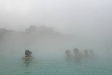 People enjoy the healing springs in the Szechenyi Medicinal Bath in Budapest, Hungary in December 22, 2022.