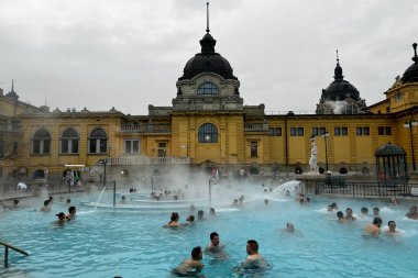People enjoy the healing springs in the Szechenyi Medicinal Bath in Budapest, Hungary in December 22, 2022.