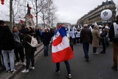 People gather in central streets to take part in a national strike against government plans to revamp the pension system in central Paris, France on January 19, 2023.