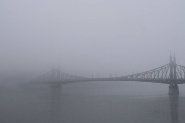 View of Margaret bridge  during a foggy day in Budapest, Hungary on December 23, 2022.