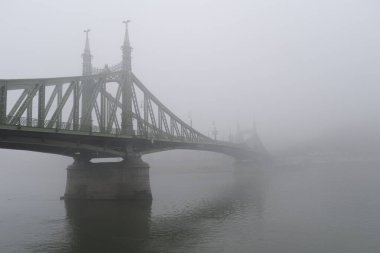 View of Margaret bridge  during a foggy day in Budapest, Hungary on December 23, 2022.