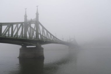 View of Margaret bridge  during a foggy day in Budapest, Hungary on December 23, 2022.