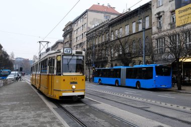 Typical yellow old tram in street of Budapest, Hungary on December 22, 2022.