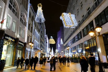 People walk in commercial district of  Budapest, Hungary on December 21, 2022.