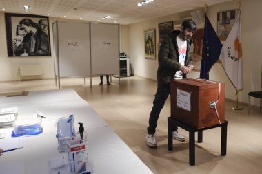 Cypriots who live abroad arrive to cast their ballots for the Cypriot presidential elections at a polling station in Brussels, Belgium on February 5, 2023.