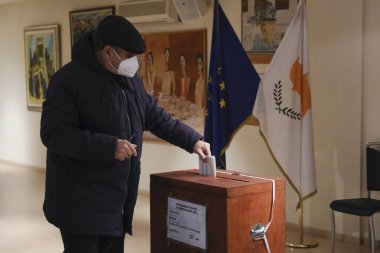 Cypriots who live abroad arrive to cast their ballots for the Cypriot presidential elections at a polling station in Brussels, Belgium on February 5, 2023.