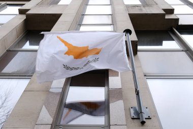 Flag of Cyprus waves outside of embassy of Cyprus  in Brussels, Belgium on February 5, 2023.