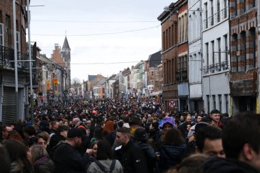 Crowd of people during the carnival festivities  in streets of Binche in Belgium on 19th Feb. 2023, 