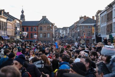Crowd of people during the carnival festivities  in streets of Binche in Belgium on 19th Feb. 2023, 