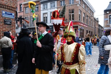 Revellers and Carvivalists celebrate during the traditional carnival parade in Binche, Belgium on 19th Feb. 2023.
