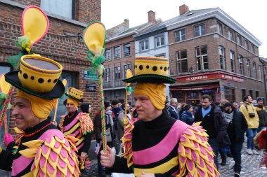 Revellers and Carvivalists celebrate during the traditional carnival parade in Binche, Belgium on 19th Feb. 2023.