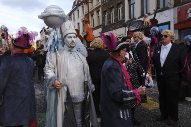 Revellers and Carvivalists celebrate during the traditional carnival parade in Binche, Belgium on 19th Feb. 2023.