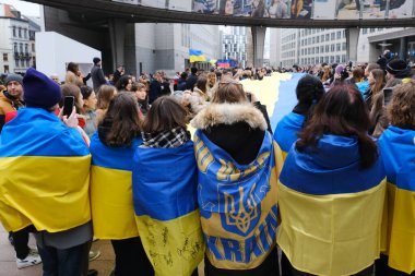 Supporters of Ukraine unfurl a giant flag in front of the EU Parliament building on the first anniversary of the Russian invasion, in Brussels, Belgium February 24, 2023.
