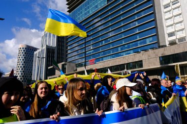 Several thousand people take part in a demonstration for the first anniversary of the Russian invasion in Brussels, Belgium on Feb. 25, 2023.