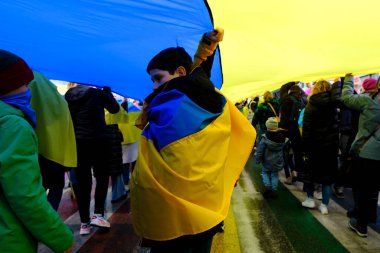 Several thousand people take part in a demonstration for the first anniversary of the Russian invasion in Brussels, Belgium on Feb. 25, 2023.