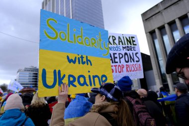 Several thousand people take part in a demonstration for the first anniversary of the Russian invasion in Brussels, Belgium on Feb. 25, 2023.