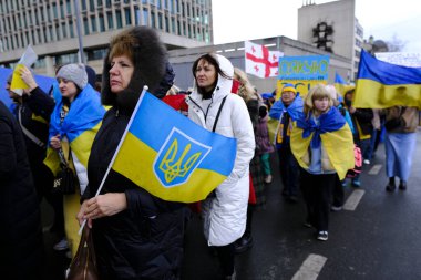 Several thousand people take part in a demonstration for the first anniversary of the Russian invasion in Brussels, Belgium on Feb. 25, 2023.