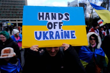 Several thousand people take part in a demonstration for the first anniversary of the Russian invasion in Brussels, Belgium on Feb. 25, 2023.