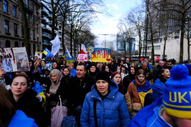 Several thousand people take part in a demonstration for the first anniversary of the Russian invasion in Brussels, Belgium on Feb. 25, 2023.