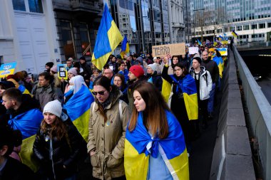 Several thousand people take part in a demonstration for the first anniversary of the Russian invasion in Brussels, Belgium on Feb. 25, 2023.