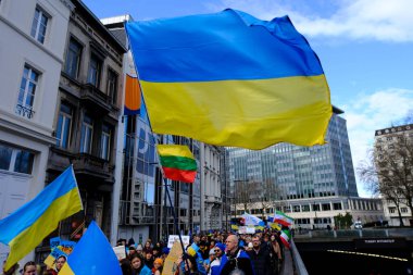 Several thousand people take part in a demonstration for the first anniversary of the Russian invasion in Brussels, Belgium on Feb. 25, 2023.