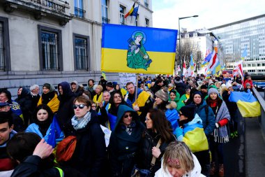 Several thousand people take part in a demonstration for the first anniversary of the Russian invasion in Brussels, Belgium on Feb. 25, 2023.