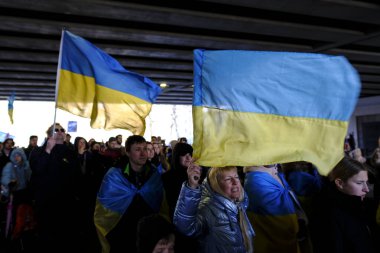 Several thousand people take part in a demonstration for the first anniversary of the Russian invasion in Brussels, Belgium on Feb. 25, 2023.