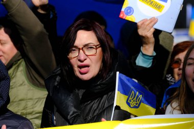 Several thousand people take part in a demonstration for the first anniversary of the Russian invasion in Brussels, Belgium on Feb. 25, 2023.