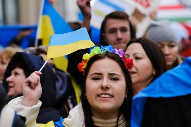 Several thousand people take part in a demonstration for the first anniversary of the Russian invasion in Brussels, Belgium on Feb. 25, 2023.