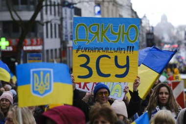 Several thousand people take part in a demonstration for the first anniversary of the Russian invasion in Brussels, Belgium on Feb. 25, 2023.