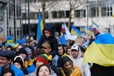 Several thousand people take part in a demonstration for the first anniversary of the Russian invasion in Brussels, Belgium on Feb. 25, 2023.